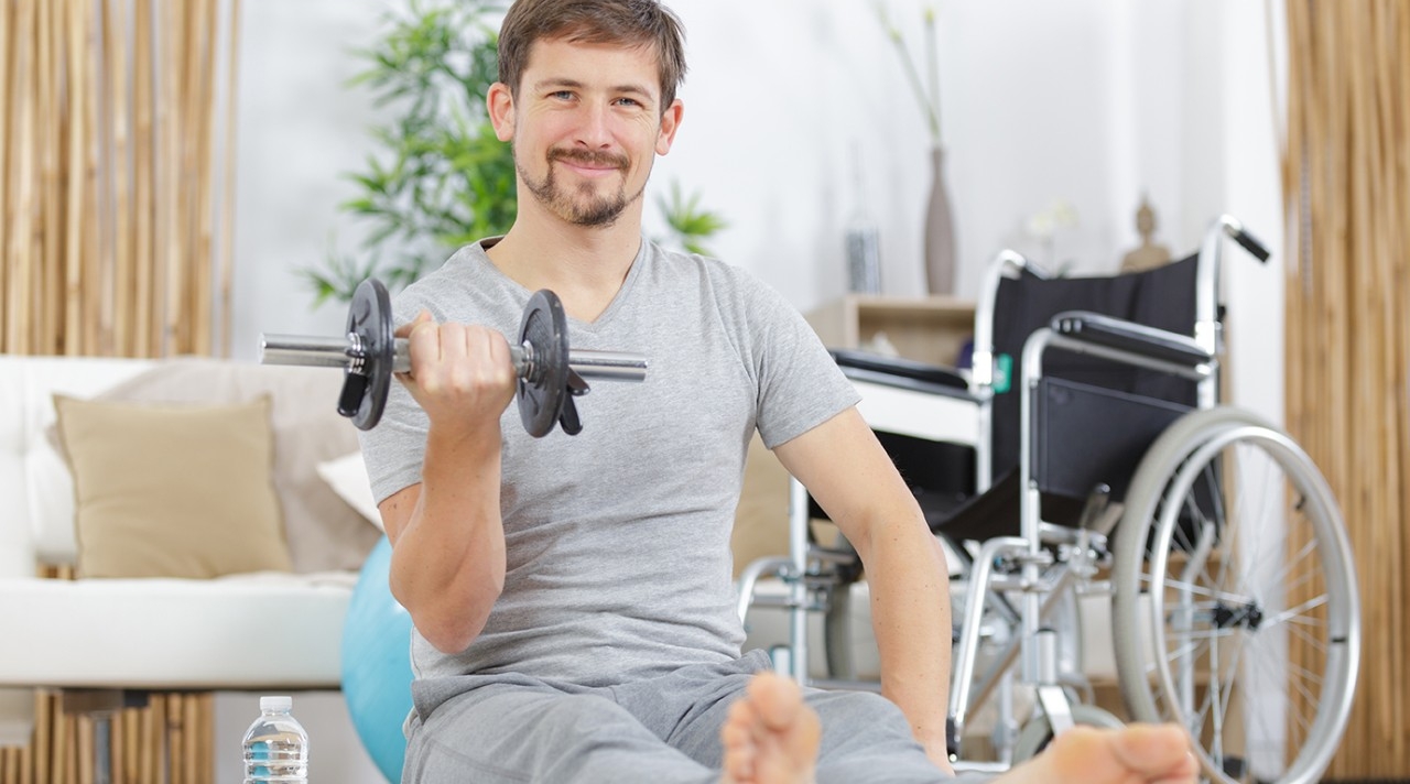 Man exercising with dumbbell 